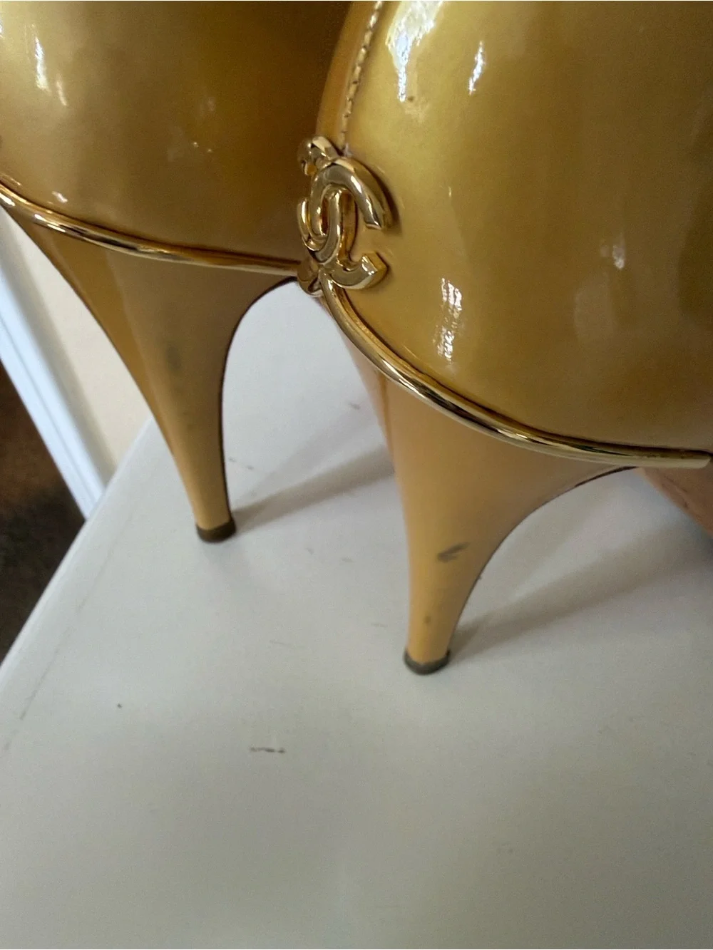 Chanel cream gold patent leather pumps